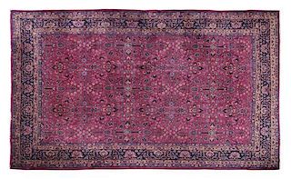 A Persian Wool Rug. 8 feet 9 inches x 12 feet.