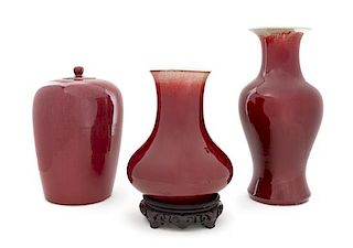 * Three Sang-de-Boeuf Glazed Porcelain Vases Height of tallest 16 1/2 inches.