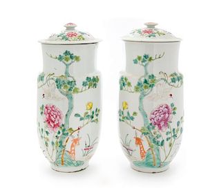 A Pair of Famille Rose Porcelain Covered Jars Height 11 inches.