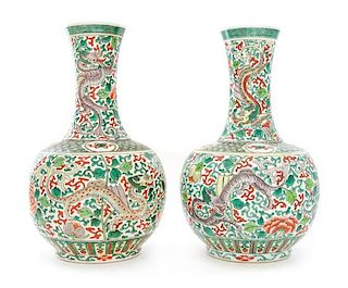 A Pair of Famille Verte Porcelain Vases Height 13 1/4 inches.