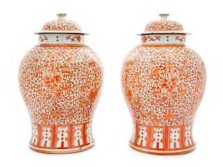 A Large Pair of Iron Red Decorated Porcelain Baluster Jars and Covers Height of each 15 1/2 inches.