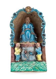 * A Turquoise, Aubergine, Yellow and Green Glazed Porcelain Shrine Height 9 1/4 inches.