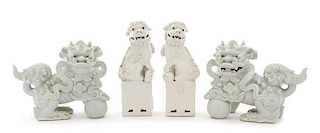 Two Pairs of Blanc-de-Chine Porcelain Figures of Fu Lions Height 8 1/4 inches.