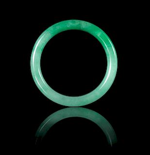 An Apple Green and Celadon Jadeite Bangle 69.08 x 7.9 mm.