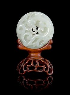 * A White Jade 'Dragon' Bi Disc Diameter 2 1/4 inches.