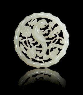 * A Pale Celadon Jade Reticulated Plaque Diameter 2 1/8 inches.