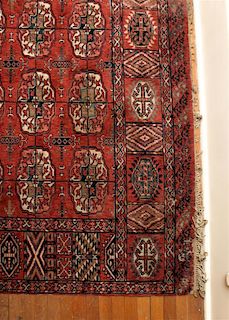 A Bokhara Wool Rug, 11 feet 8 inches x 8 feet 7 inches.