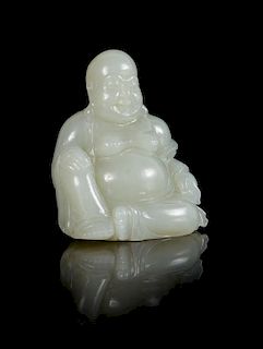 * A Carved White Jade Figure of Laughing Buddha Height 2 3/4 inches.