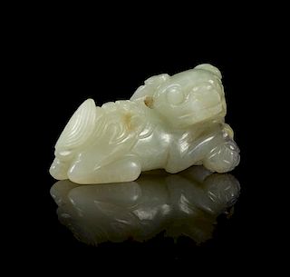 * A Pale Celadon Jade Figure of a Fu Lion Length 1 7/8 inches.