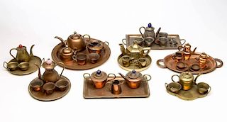 ASSORTED BRASS AND COPPER MINIATURE / DOLL TEA SETS, LOT OF EIGHT