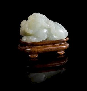 * A White Jade Figure of a Recumbent Fu Lion Length 2 inches.