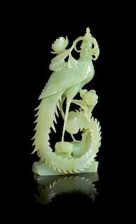 * A Green Jade Figure of a Phoenix Height 8 inches.