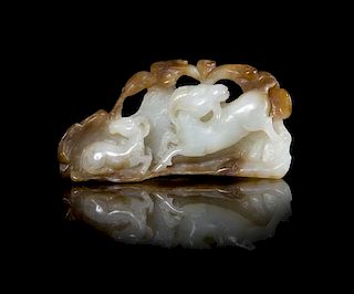 A Carved Russet and White Jade Figural Group of Double Rams Length 2 5/8 inches.