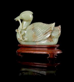 * A Celadon and Russet Jade Figure of a Duck Height 6 3/4 inches.