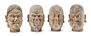 Four Carved Wood Heads of Luohan Height of each 30 inches.