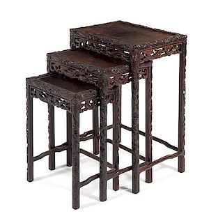 A Carved Hardwood Nesting Table Height 27 3/4 x width 20 1/2 x depth 14 inches.