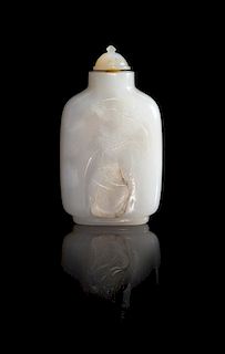 * A Carved White Jade Snuff Bottle Height 3 inches.