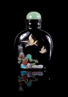 A Mother-of-Pearl and Hardstone Inset Black Glass Snuff Bottle Height 3 inches.