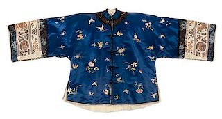 * A Chinese Embroidered Silk Blue Ground Lady's Winter Jacket Height collar to hem 27 inches.