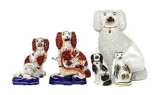 Four Staffordshire Polychrome Decorated Dogs, Height of first 9 1/4 inches.