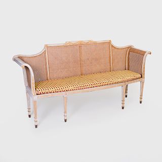George III Style Grey Painted, Parcel-Gilt And Caned Settee