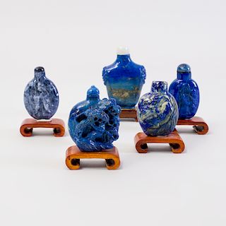 Group of Four Chinese Lapis Lazuli Snuff Bottles and a Sodalite Snuff Bottle 