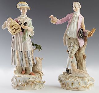 Pair of Finely Painted Meissen Porcelain Figures, 19th c., of a couple in 18th c. costumes, the woman holding a bird and birdcage, with a lamb at her 