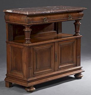 French Henri II Style Carved Walnut Marble Top Sever, c. 1880, the stepped rounded edge rouge marble over a convex frieze drawer above open storage an