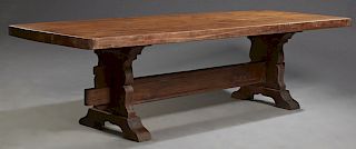 French Provincial Carved Oak Farmhouse Table, c. 1900, the thick rectangular plank top on a trestle base joined by a thick stretcher, H.- 28 3/4 in., 