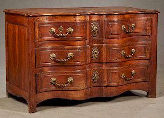 French Louis XV Style Carved Walnut "Arbalete" Bombe Commode, c. 1750, the stepped serpentine edge top over two bow front frieze drawers above two ser