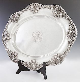 Oval Sterling Serving Platter, late 19th c. By Meriden Britannia Co. , the scalloped rim with relief Art Nouveau flowers, the center monogrammed "TC,"