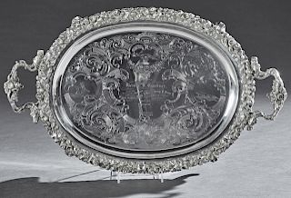 Jones, Shreve and Brown Pure Coin Silver Oval Presentation Serving Tray, 1857, Boston, with a high relief border of oak leaves and acorns, around a ce