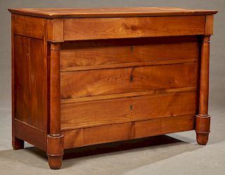 French Empire Style Carved Cherry Commode, early 19th c., the rectangular top over a frieze drawer and three setback drawers flanked by turned columns