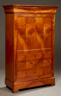 French Louis Philippe Style Carved Cherry Secretaire Abattant, c. 1860, the rounded corner top over a cavetto frieze drawer and a fall front with an i
