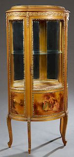Louis XV Style Giltwood Ormolu Mounted Curved Glass Vitrine, early 20th c., the stepped oval top over a curved glass door flanked by curved glass side
