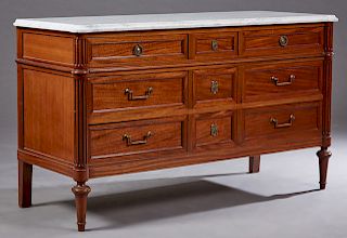 French Louis XVI Style Carved Mahogany Marble Top Dresser, early 20th c., the figured white cookie cornered ogee edge marble top over a central bank o