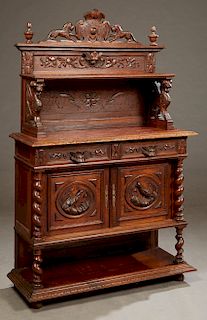 French Henri II Style Carved Oak Marble Top Server, c. 1880, with a pierced medallion crest flanked by lion supports and urn form finials, over an ope