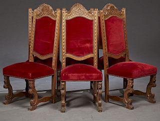 Set of Six French Carved Oak Renaissance Style Dining Chairs, early 20th c., the arched upholstered backs with rosette crests, on lappet supports to a