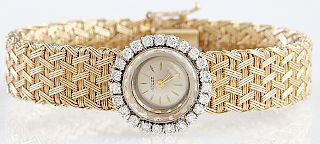 Lady's 14K Yellow Gold Adler Manual Wind Wristwatch, c. 1960, with a diamond mounted bezel and a gold mesh band, purchased from Adler's, New Orleans, 