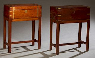 Two English Campaign Style Brass Bound Mahogany Lap Desks, 19th c., with fitted interiors with baize lined writing surfaces, both on later square ba