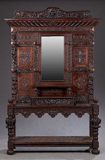 Unusual French Carved Oak Renaissance Style Hall Stand, late 19th c., the arched lion and floral carved crest over a sloping crown above a central bev
