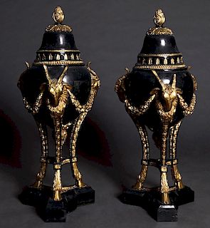 Pair of Louis XVI Style Black Marble and Composition Covered Garniture Urns, 20th c., the lid with a gilt finial to a baluster side with three gilt ra