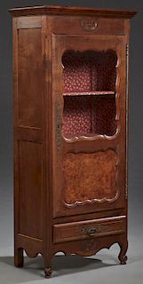 French Louis XV Style Carved Cherry and Elm Bonnetiere, late 19th c., the stepped crown over a double panel door with a long steel fiche hinge and esc