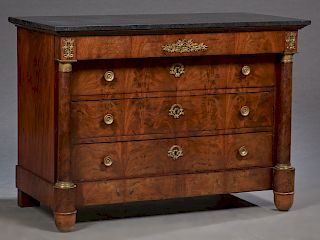 French Empire Style Ormolu Mounted Carved Walnut Marble Top Commode, c. 1880, the figured black marble over a frieze drawer and three setback drawers 