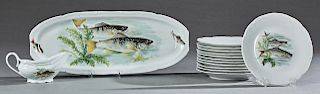 Twenty Piece French Porcelain Fish Set, 20th c., consisting of a fourteen piece set by Porcelaines de Sologne, comprised of 12 plates, on oval platter