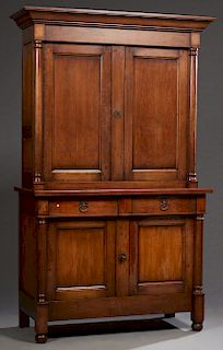 French Provincial Carved Cherry Buffet a Deux Corps, 20th c., the stepped ogee crown over double setback cupboard doors, flanked by engaged columns, o