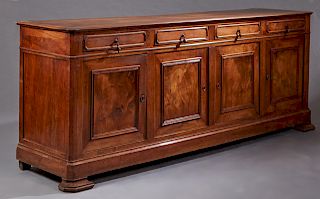 French Provincial Louis Philippe Style Carved Walnut Sideboard, mid-19th c., the stepped canted corner top over four frieze drawers, above two large c