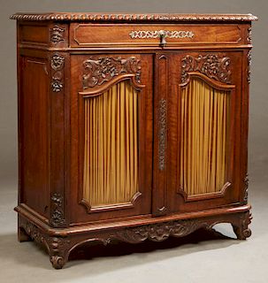 French Louis XV Style Carved Walnut Sideboard, 19th c. the rectangular rounded corner gadroon edge top over a long frieze drawer, above double arched 