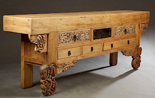 Chinese Style Natural Mahogany Altar Table, 20th c., the rectangular top over three center frieze drawers above four drawers on mythical figure carved