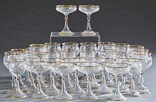 Set of Thirty-Five Gilt Rimmed Etched Crystal Wine and Champagne Glasses, early 20th c., consisting of 11 white wines, 11 red wines, and 13 champagnes